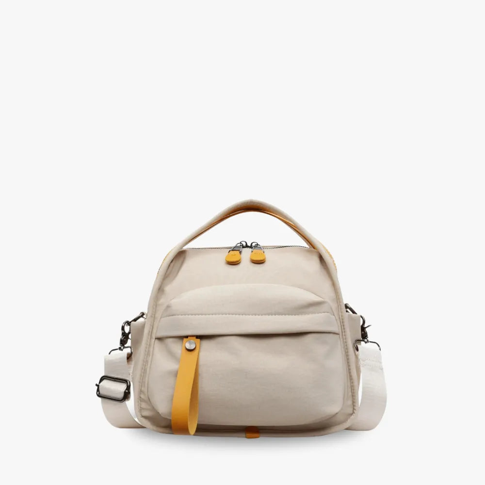 Bolso Amalfi de nailon en beige con detalle amarillo, vista frontal