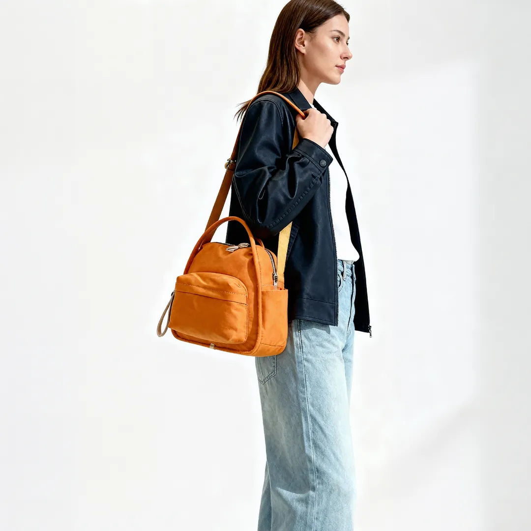 Bolso Amalfi en naranja llevado al hombro
